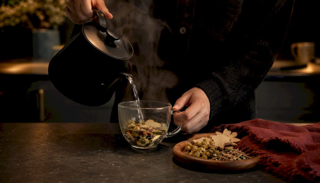 Hands pouring hot water over herbal tea leaves